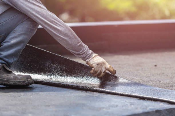 Professional Basement Waterproofing technician working in Kendall, NY